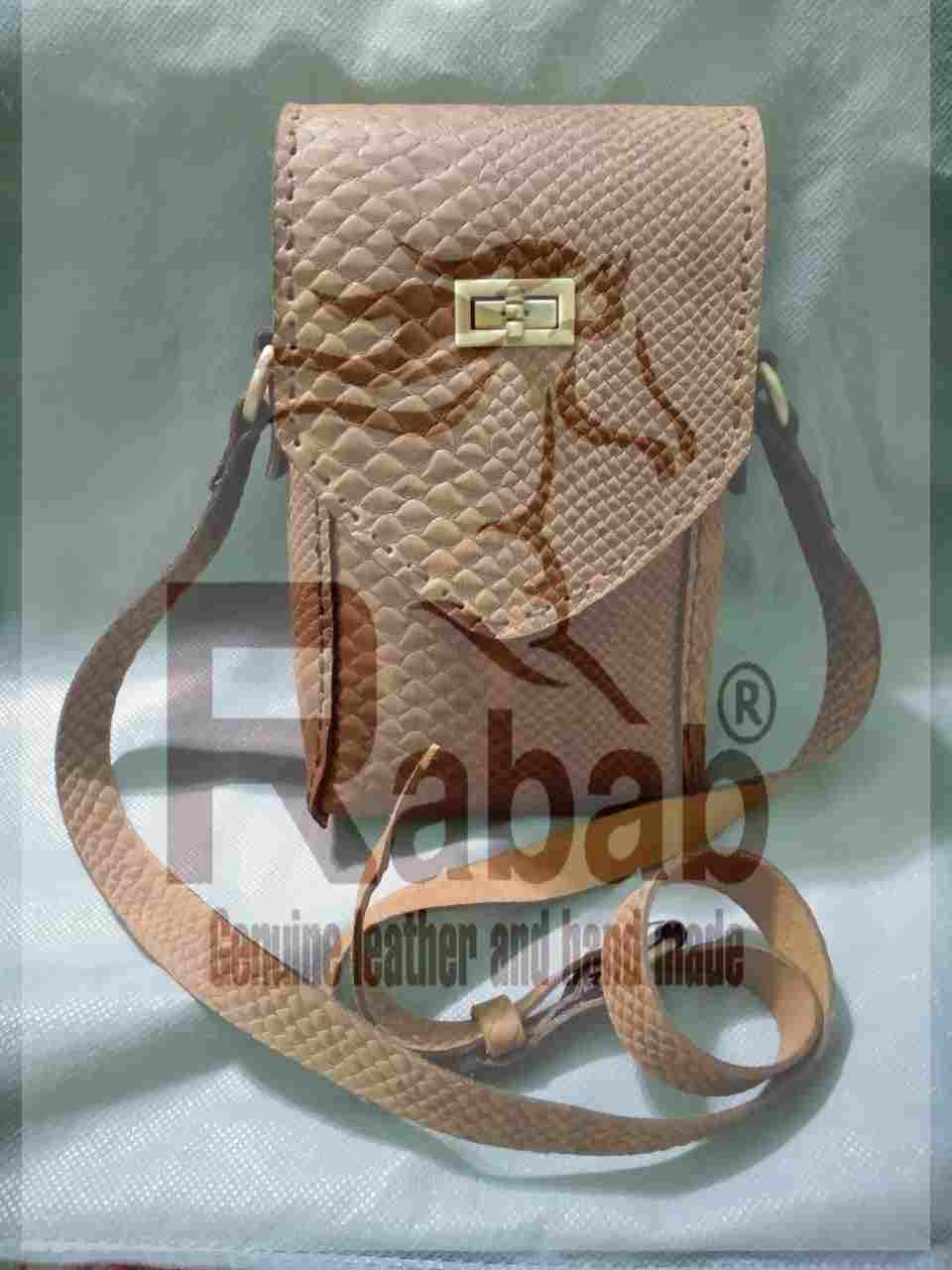 Hand made natural leather mobile bag made of genuine leather with a snake print and lined from the inside