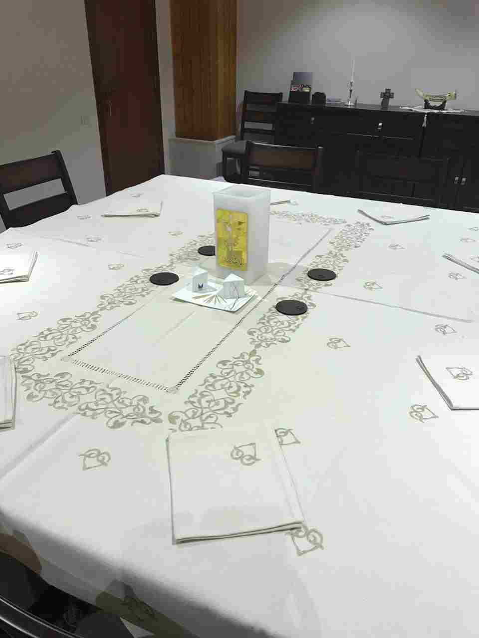 A linen tablecloth on heavy cotton, and it has 12 towels