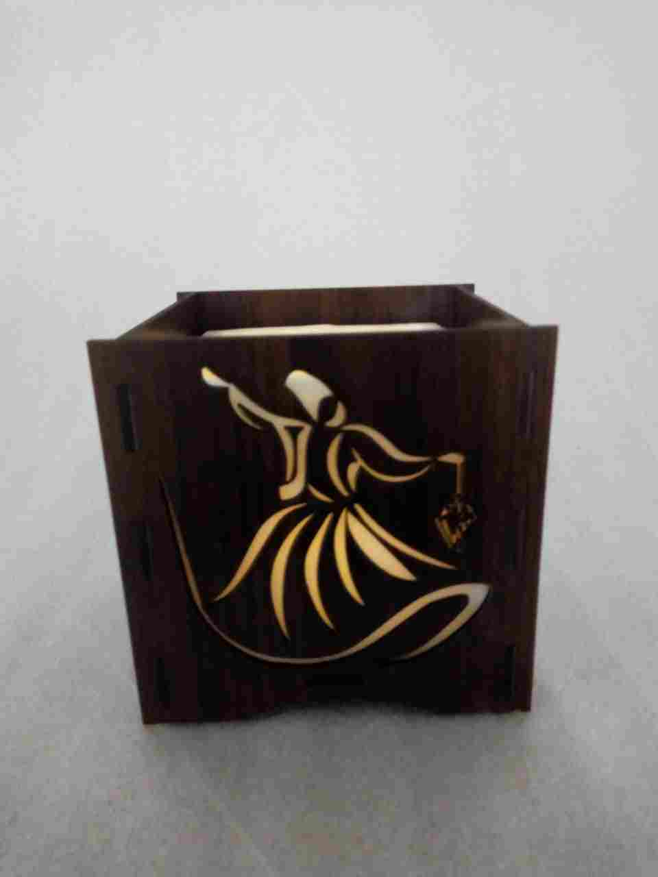 Permanent vacuum wax inside a small candle with the scents of Ramadan Inside a wood box engraved Ramadan shapes