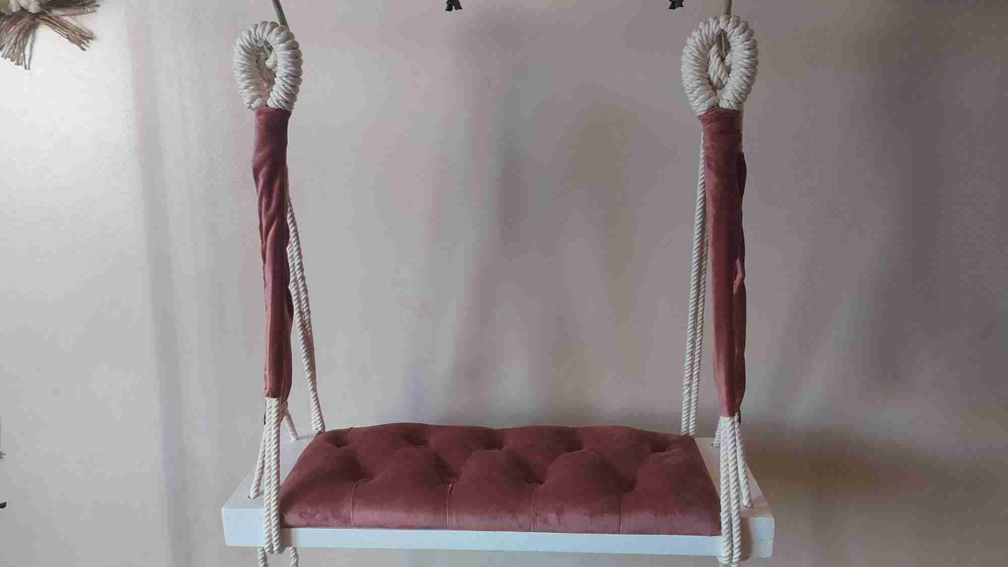 A new swing shape made by hand of macrame thread and wood