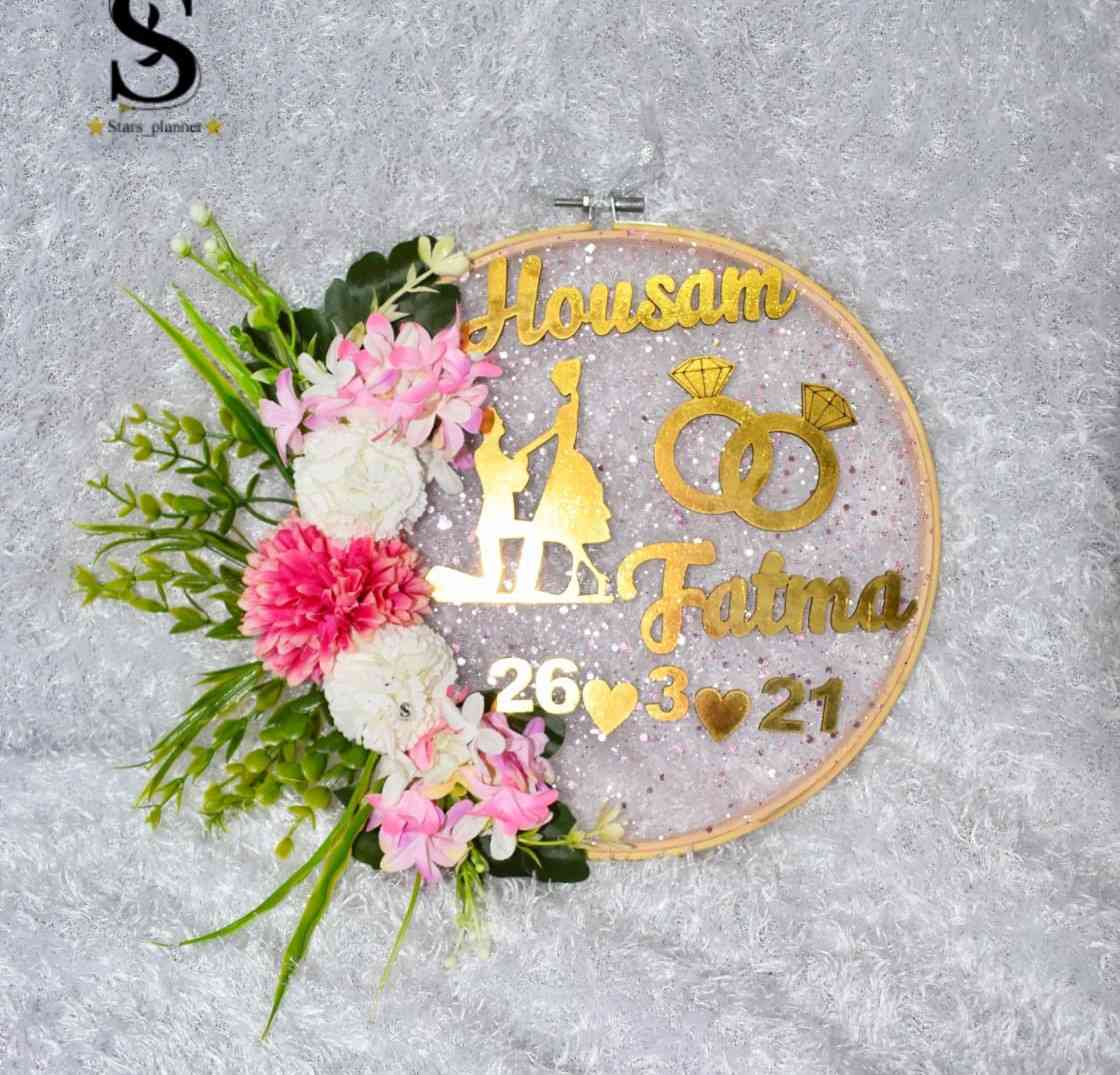 The engagement hoop decorated with artificial flowers