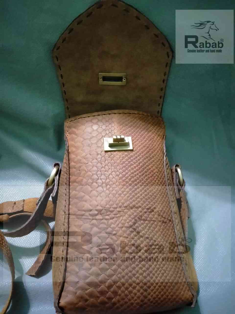 Hand made natural leather mobile bag made of genuine leather with a snake print and lined from the inside