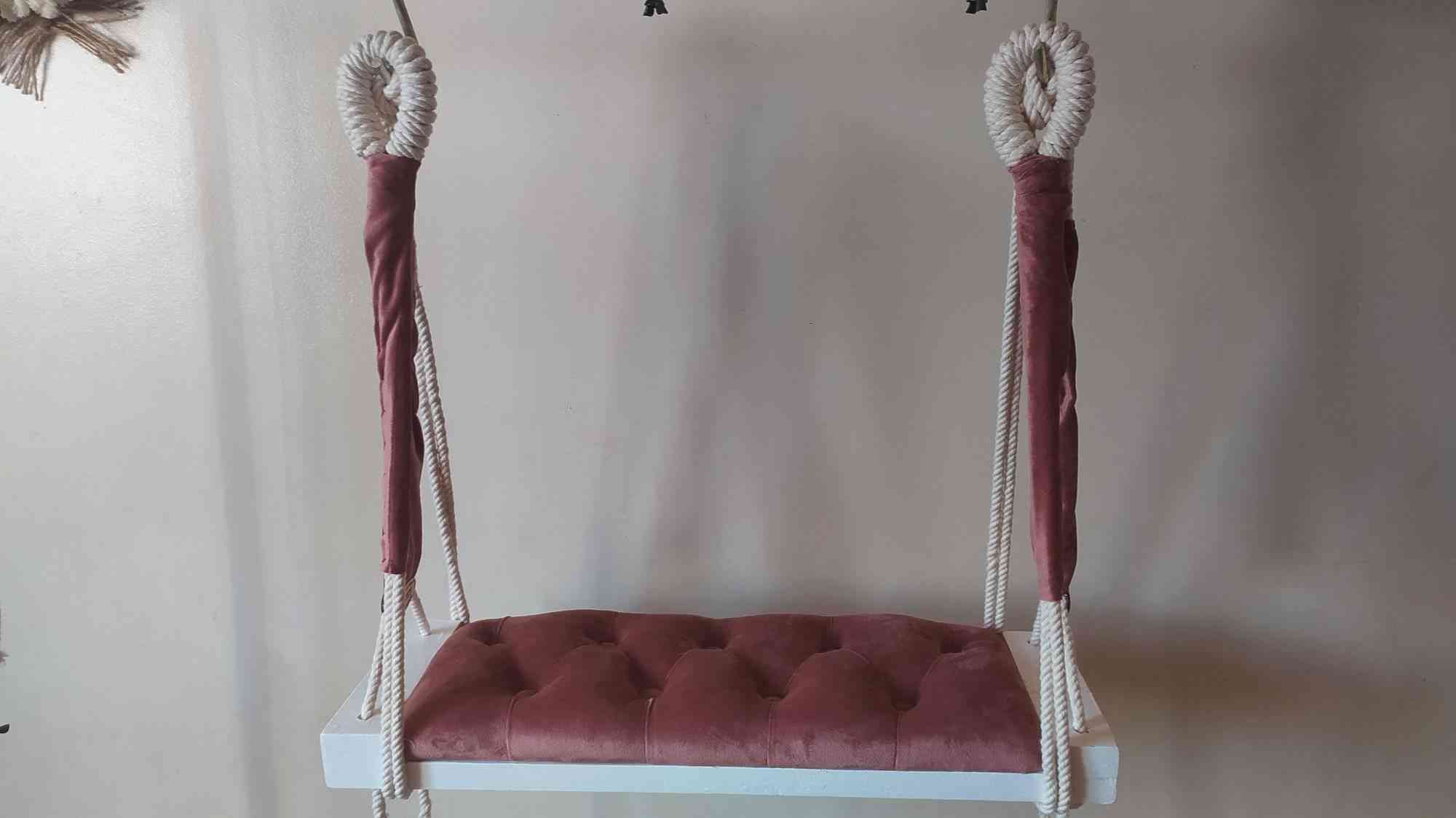 A new swing shape made by hand of macrame thread and wood