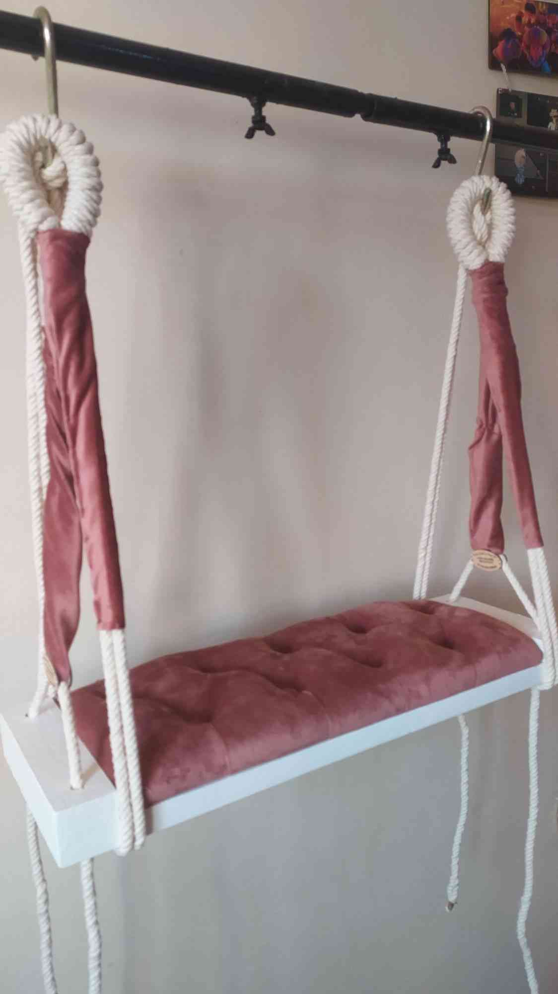 A new swing shape made by hand of macrame thread and wood