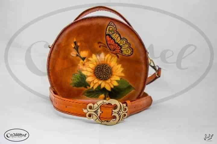 A small cross bag of natural leather, hand painted