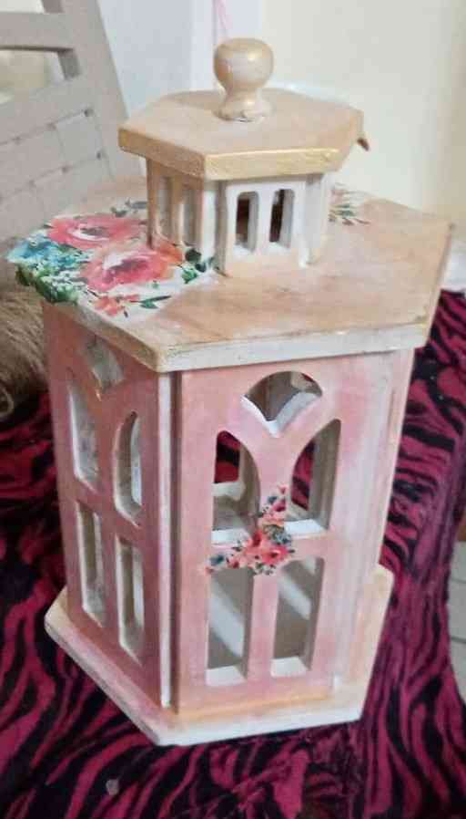 The lantern is a decoupage wood