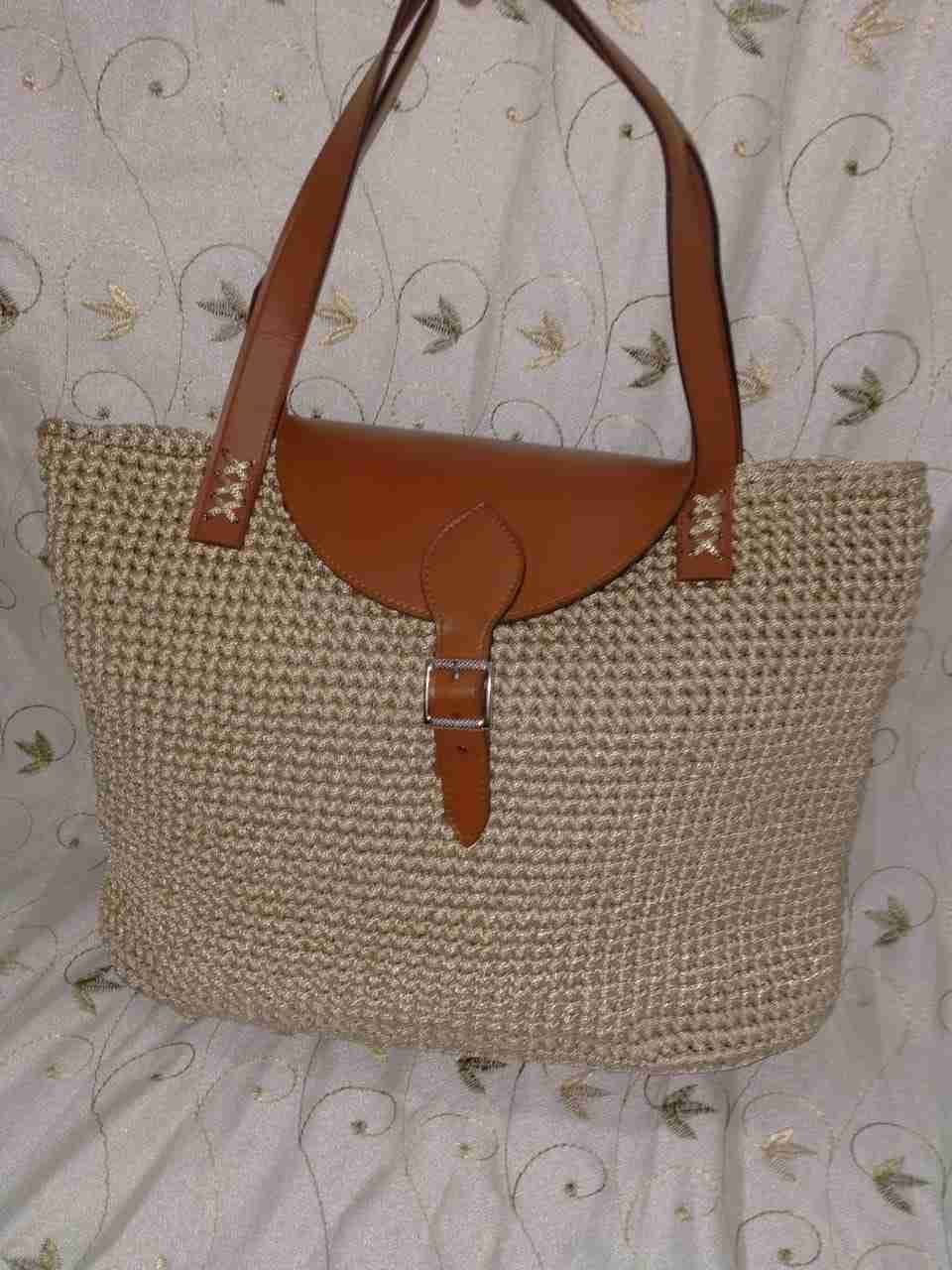 A crochet bag, burlap thread, with a genuine leather hand
